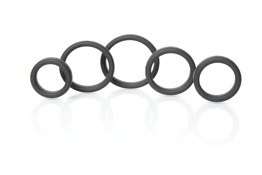 Black rubber o-rings of varying sizes arranged in a row from boneyard silicone ring 5 pc kit black