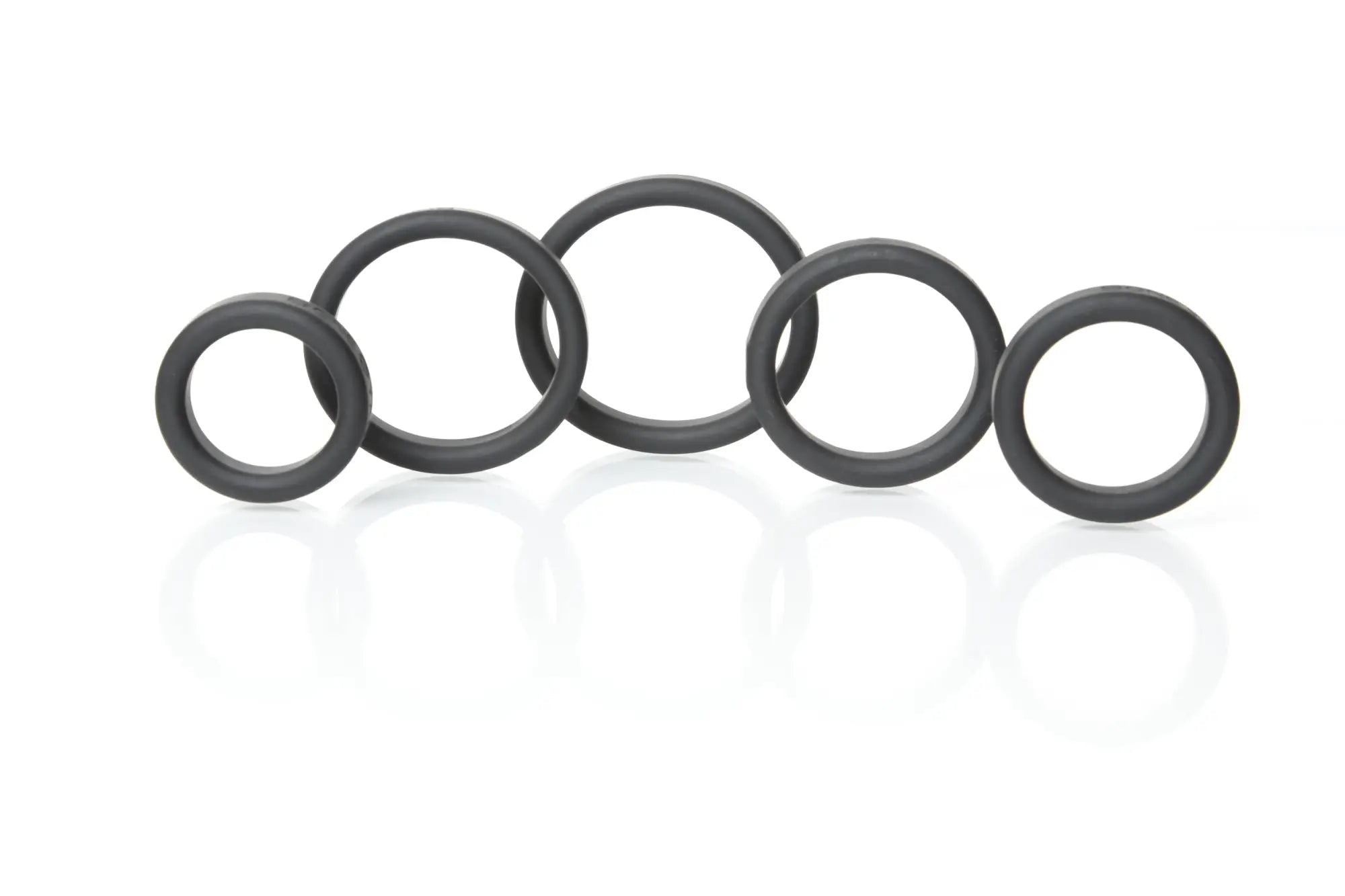 Black rubber o-rings of varying sizes arranged in a row from boneyard silicone ring 5 pc kit black