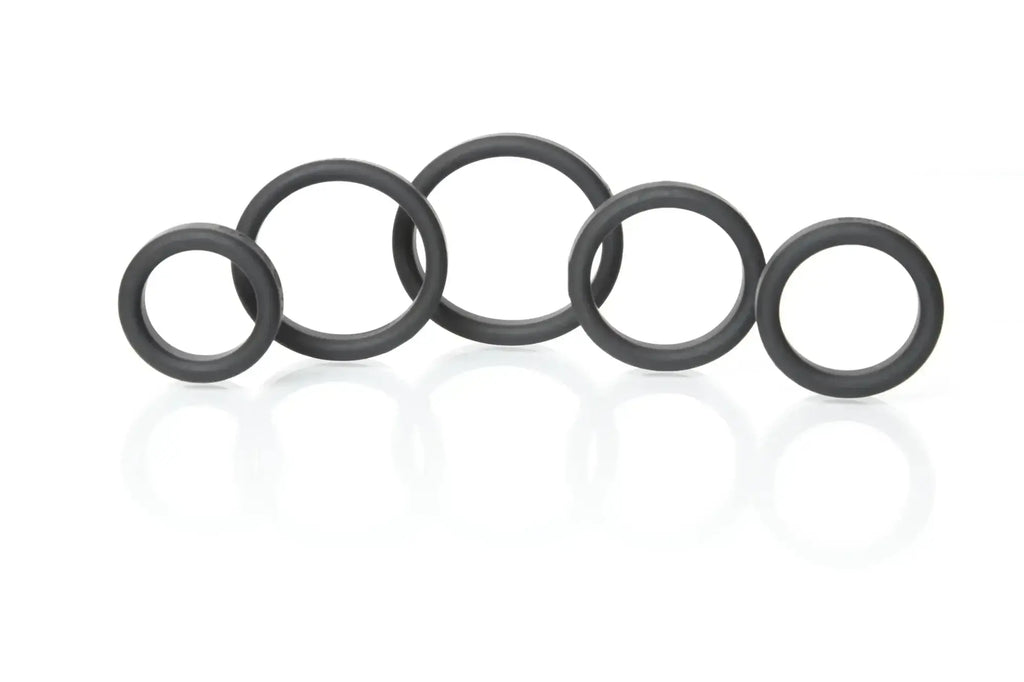 Black rubber o-rings of varying sizes arranged in a row from boneyard silicone ring 5 pc kit black