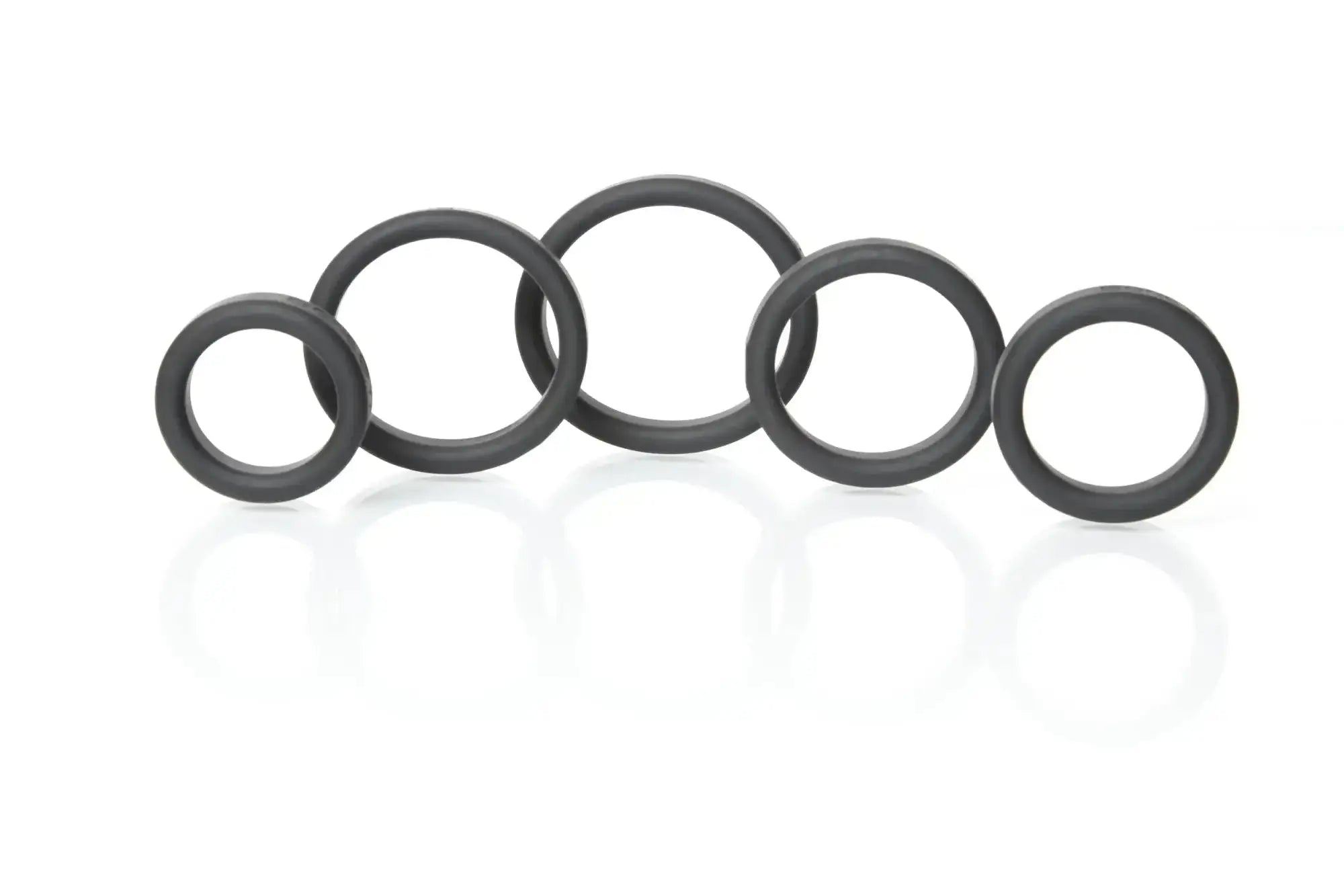 Black rubber o-rings of varying sizes arranged in a row from boneyard silicone ring 5 pc kit black