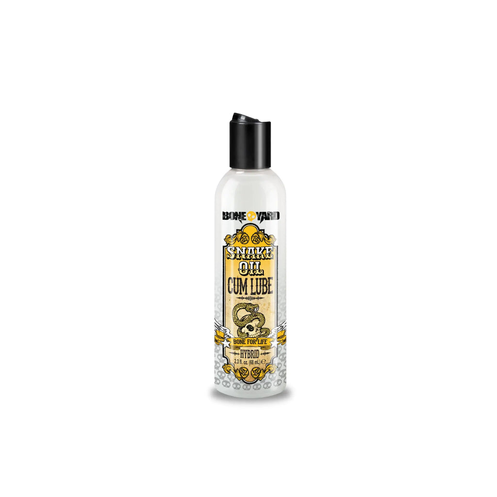 Bone yard snake oil cum lube 2oz clear bottle with black cap and ornate gold label featuring skull and snake design