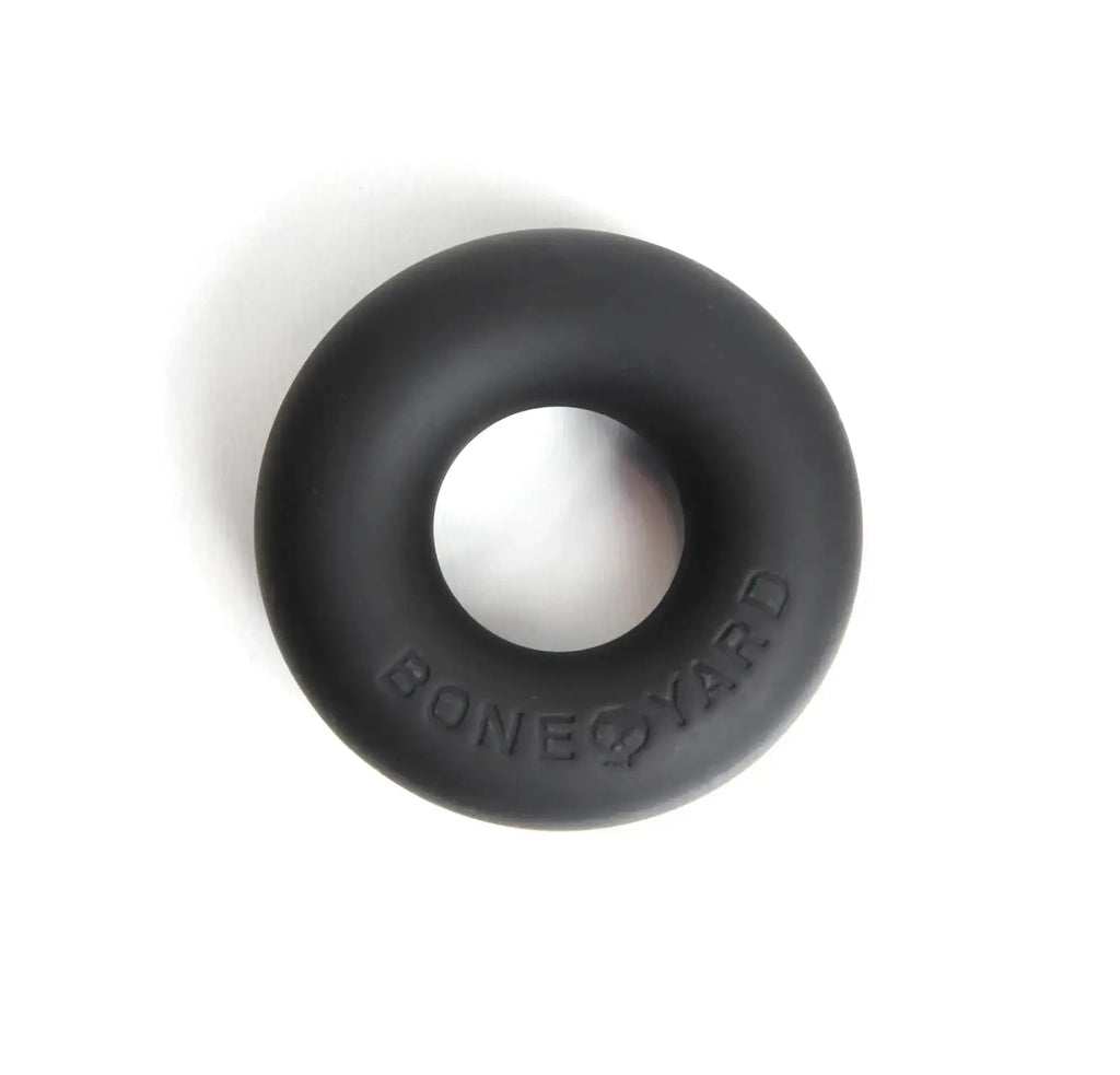 Black silicone cock ring with bone yard embossed detail designed for comfort and durability