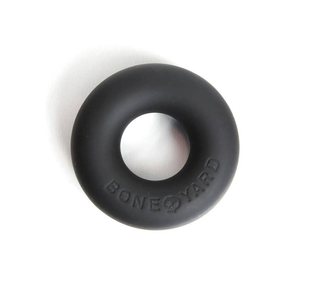 Black silicone cock ring with bone yard embossed detail designed for comfort and durability