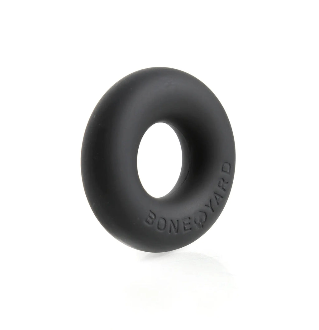 Black silicone cock ring with boneyard embossed on its side designed for ultimate comfort and durability