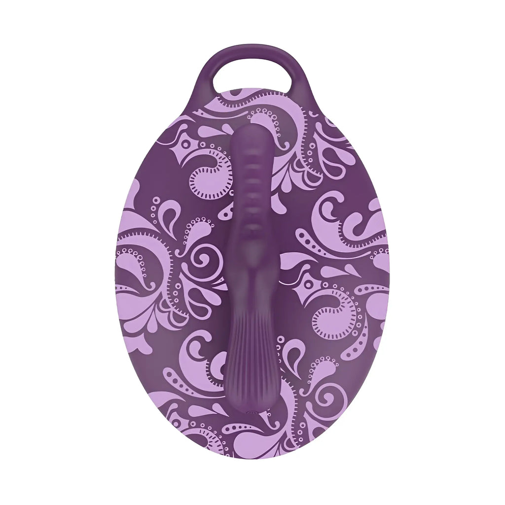 Purple oval-shaped silicone bath toy with paisley pattern and handle from bouncy bliss flow inflatable sit-on massager