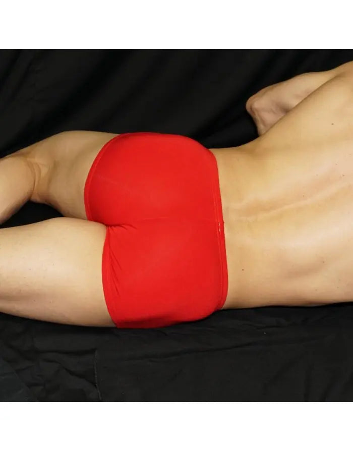 Red viscose boxer underwear by Arroyman featuring a snug fit and smooth fabric shown on a model from the side.