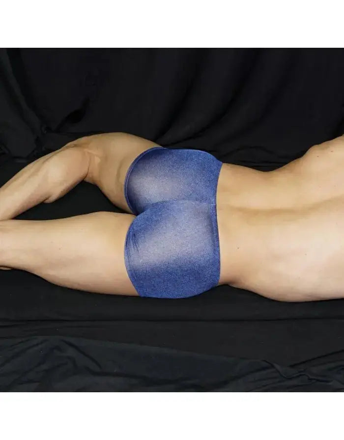 Blue bicolor boxer shorts by Arroyman featuring a snug fit and soft fabric shown on a model lying down.