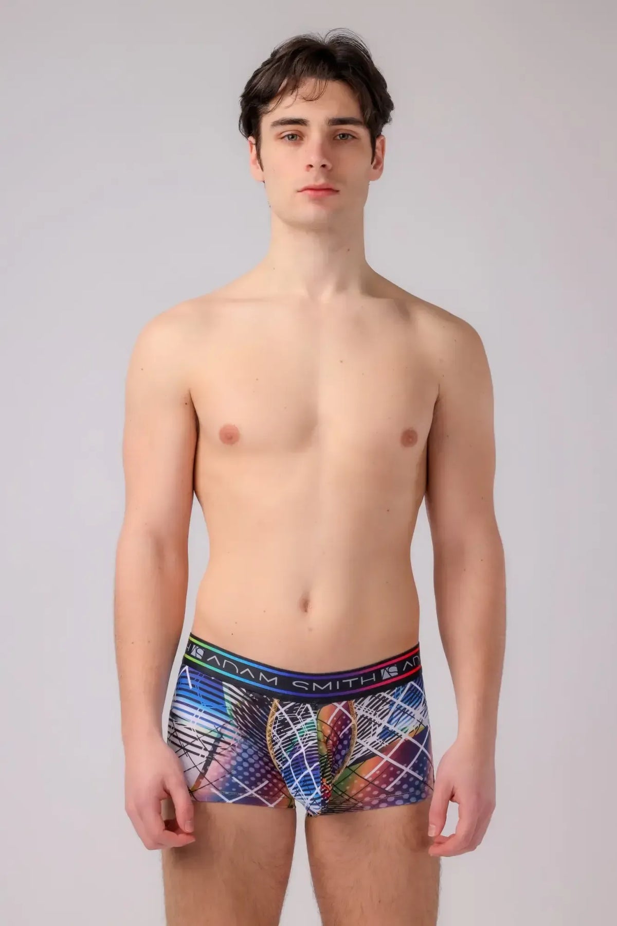 Adam Smith menâs boyshort boxer briefs with vibrant abstract geometric pattern in blues reds purples and colorful waistband