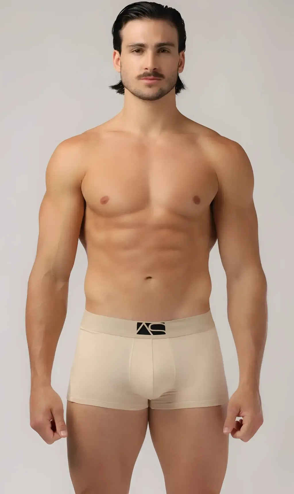 Beige menâs brief trunks with a black logo on the waistband made of soft breathable fabric