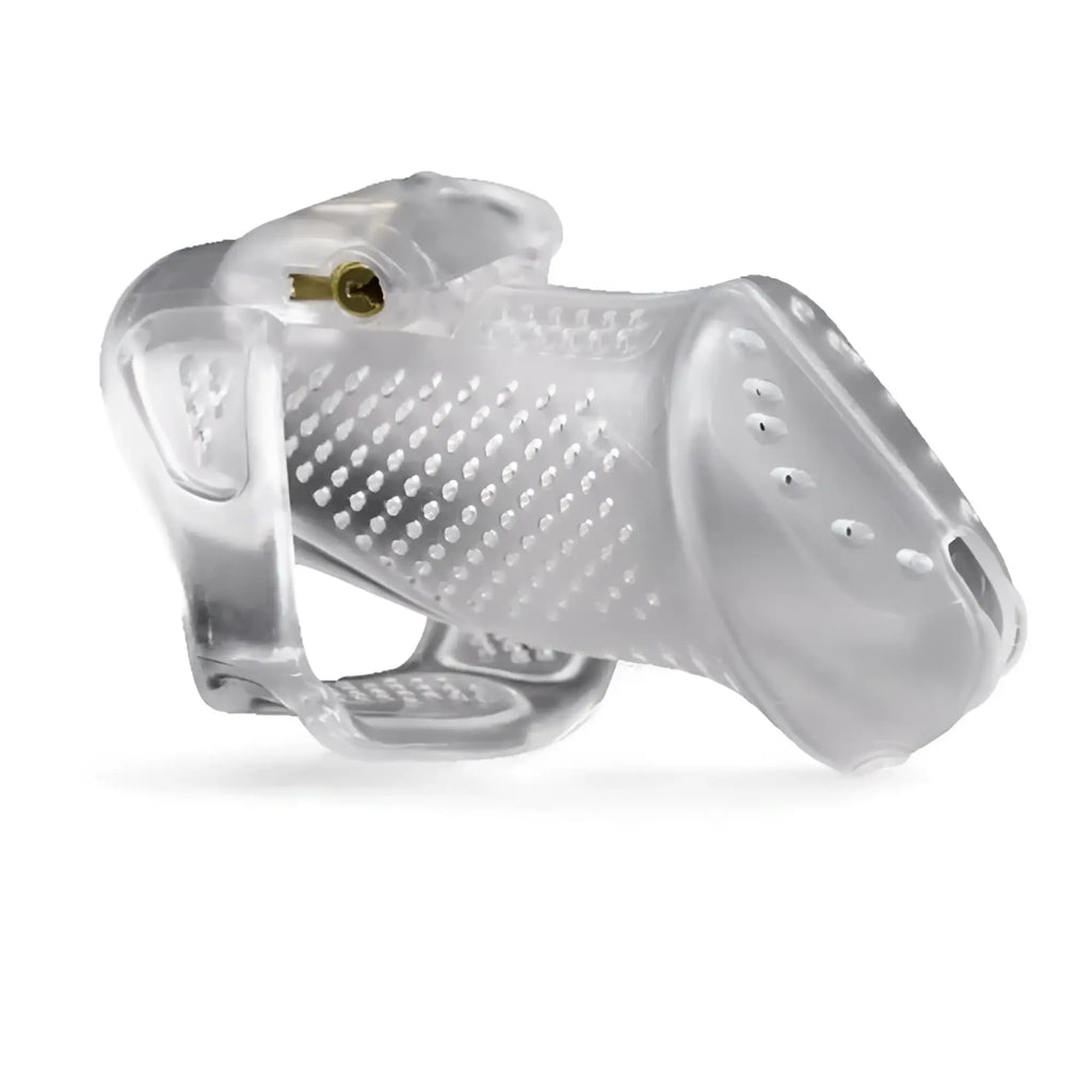 Brutus airmesh chastity cage clear is a clear plastic cage with textured surface and gold-colored metal lock