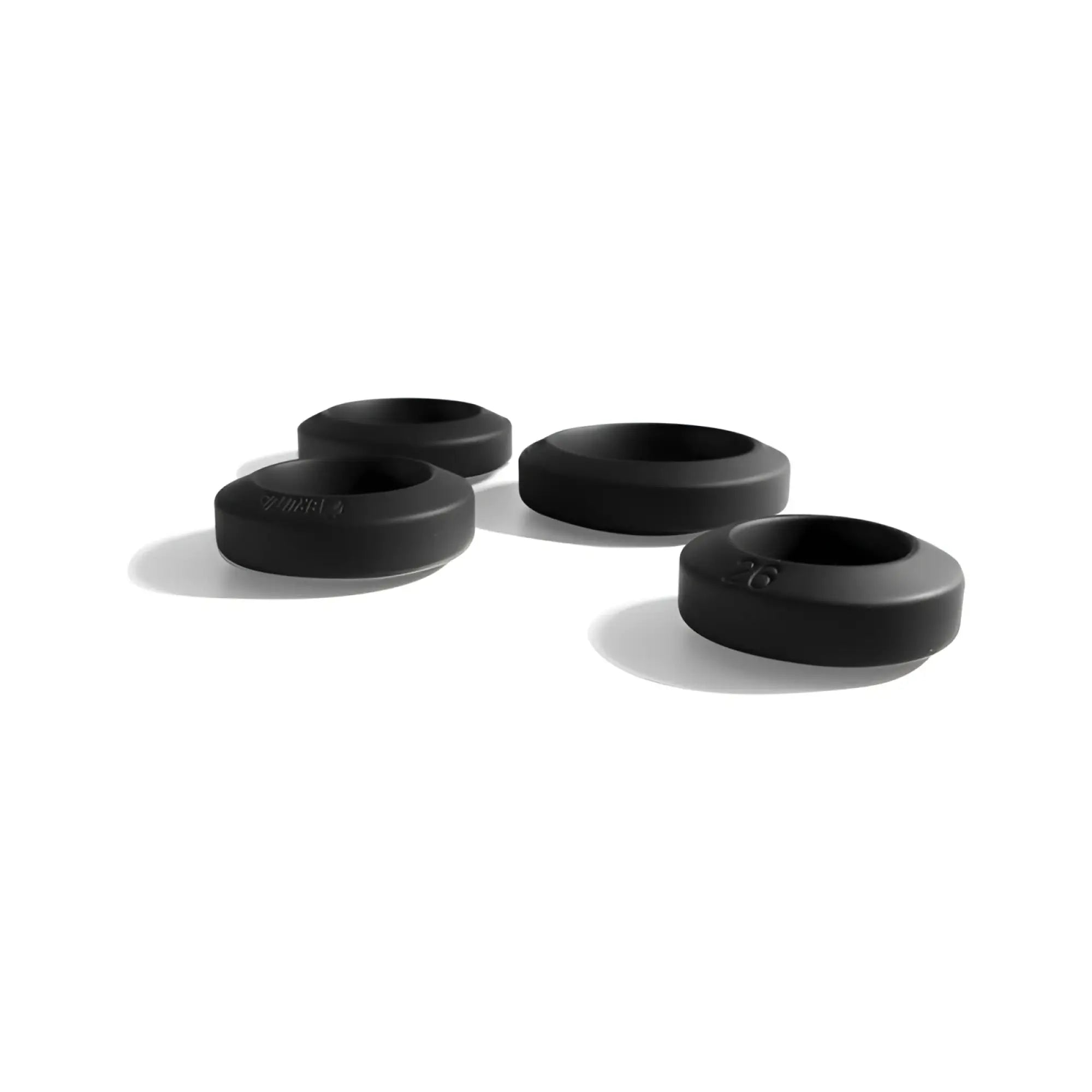 Black rubber grommets with smooth matte finish in brutus big bulge silicone cock ring 4 pc set