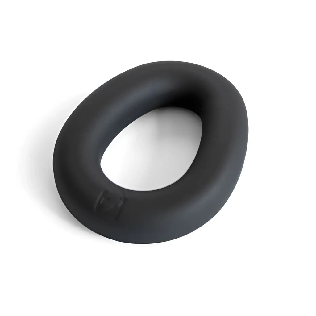 Black hypersoft silicone ergo cockring by brutus with a smooth matte finish and slightly irregular oval shape