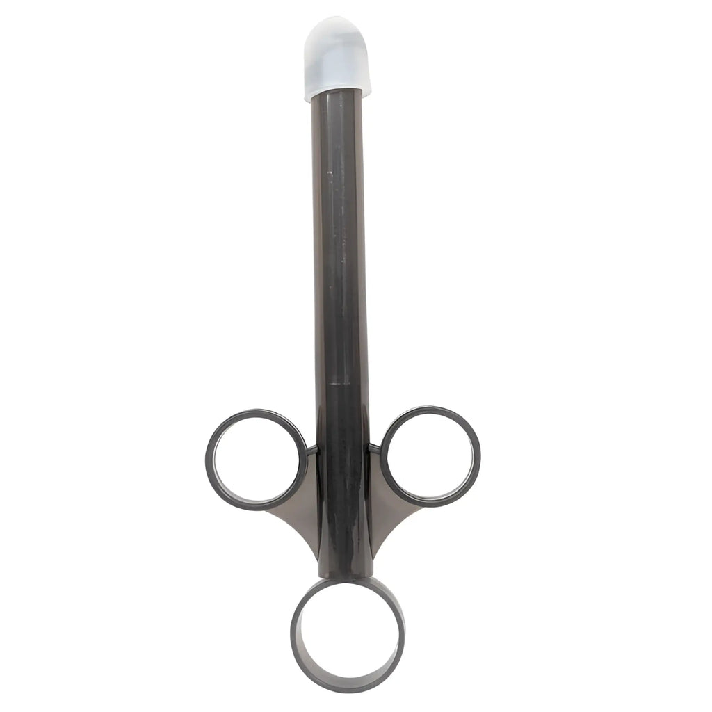 Black plastic three-ring finger ring holder with translucent white cap in brutus lube launcher 2 pc set