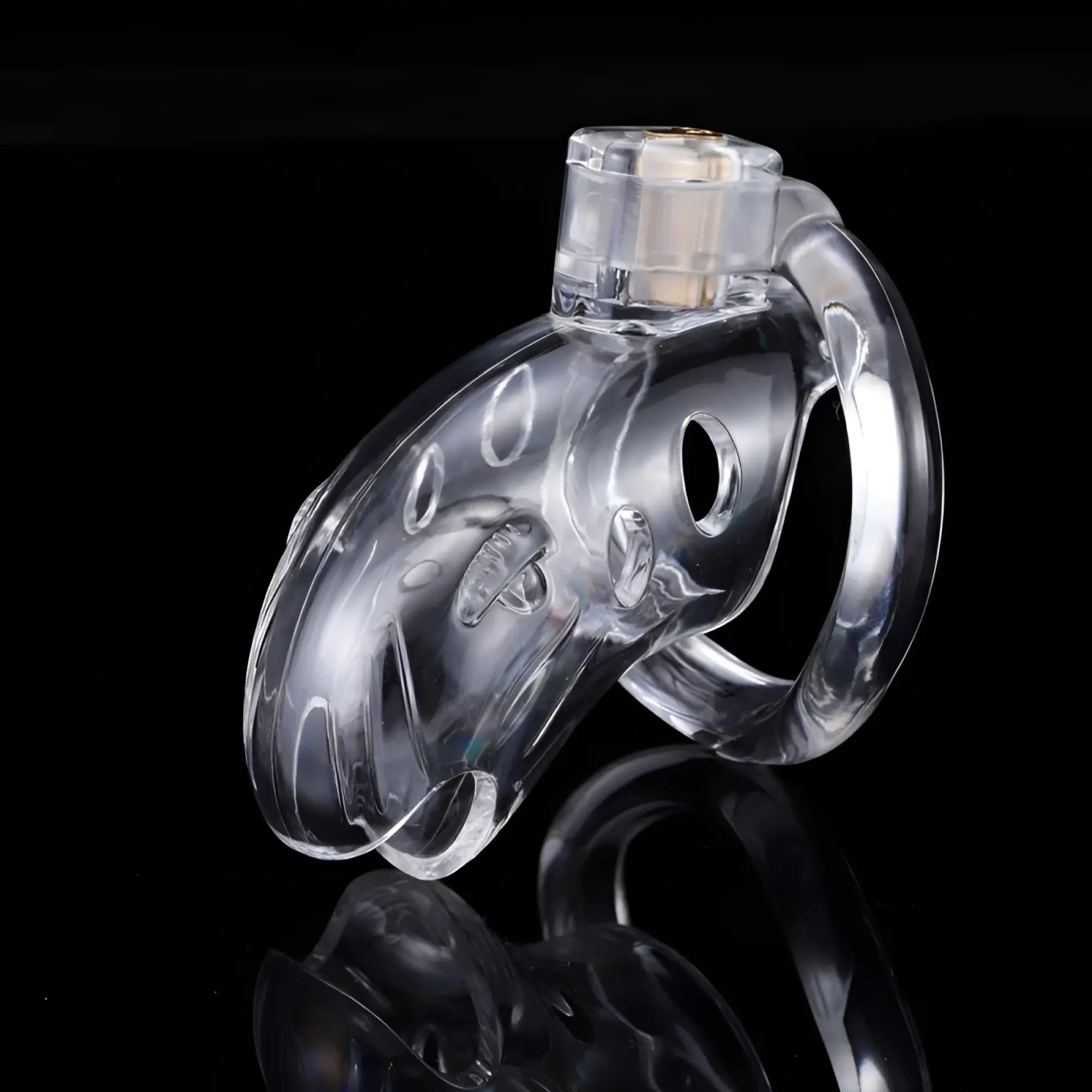 Brutus brutus shark chastity cage clear with transparent ring and gold toned metal insert made of clear plastic