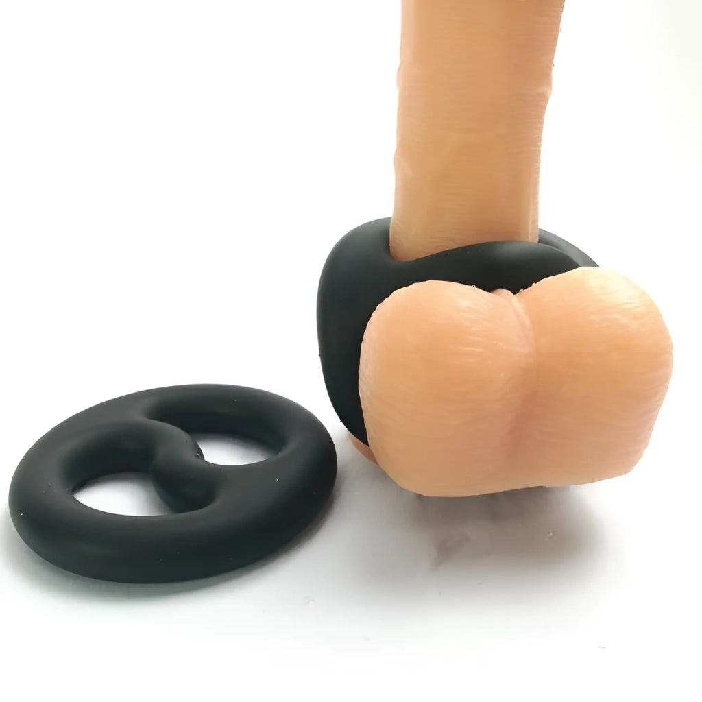 Black silicone ring with flesh toned anatomical insert designed as brutus yin yang silicone cock and ball duo ring