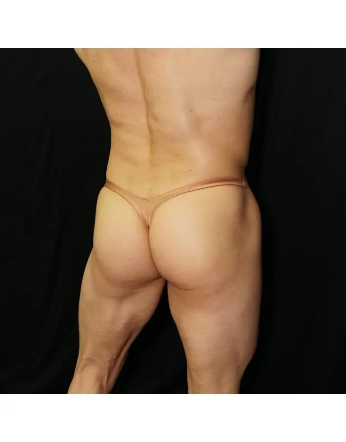 Copper thong underwear by Arroyman featuring a minimal back design and soft material shown on a model from the rear.