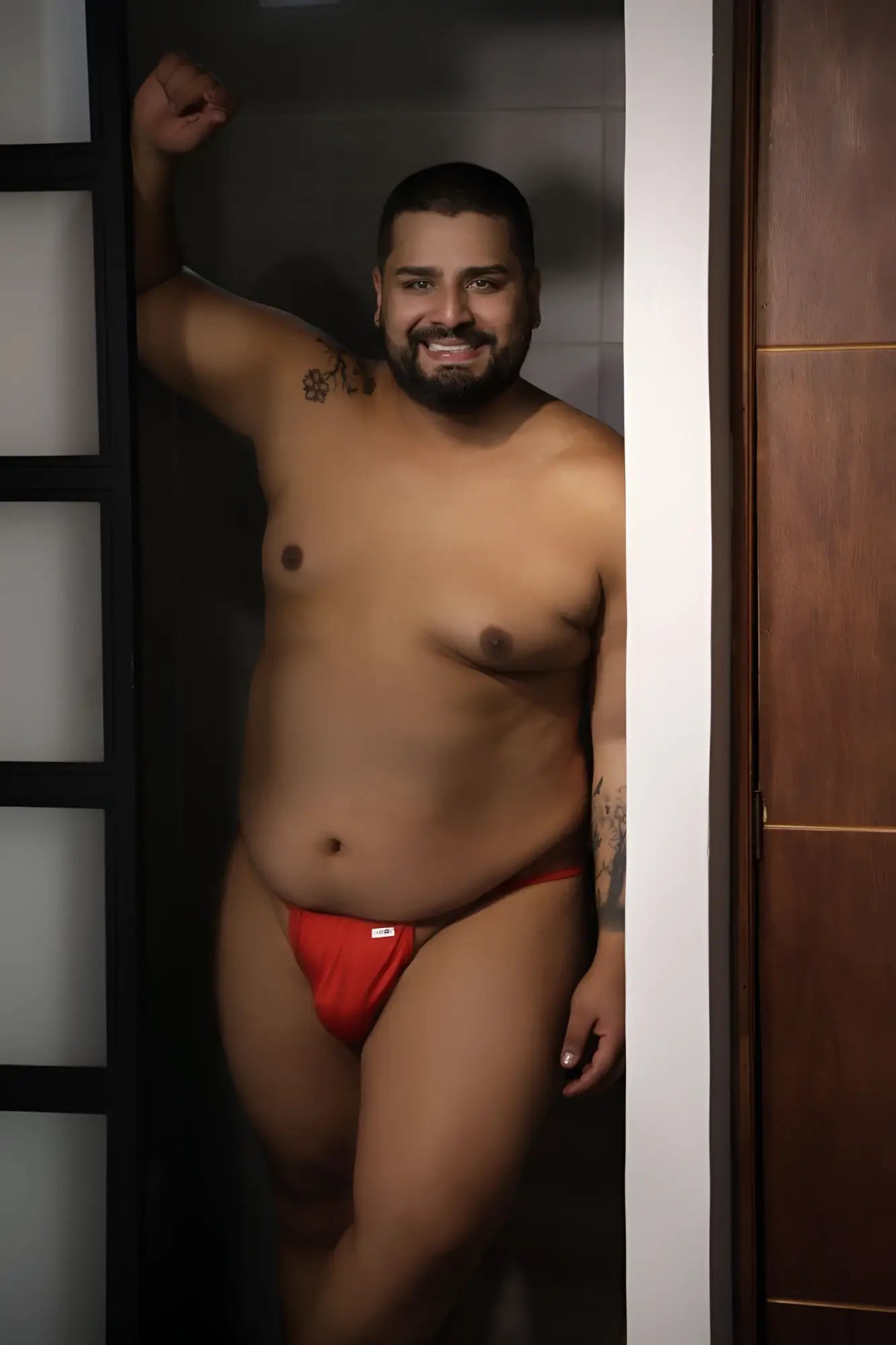 Red CandyMan 9586X thong briefs with a small white logo on the front in soft stretch fabric