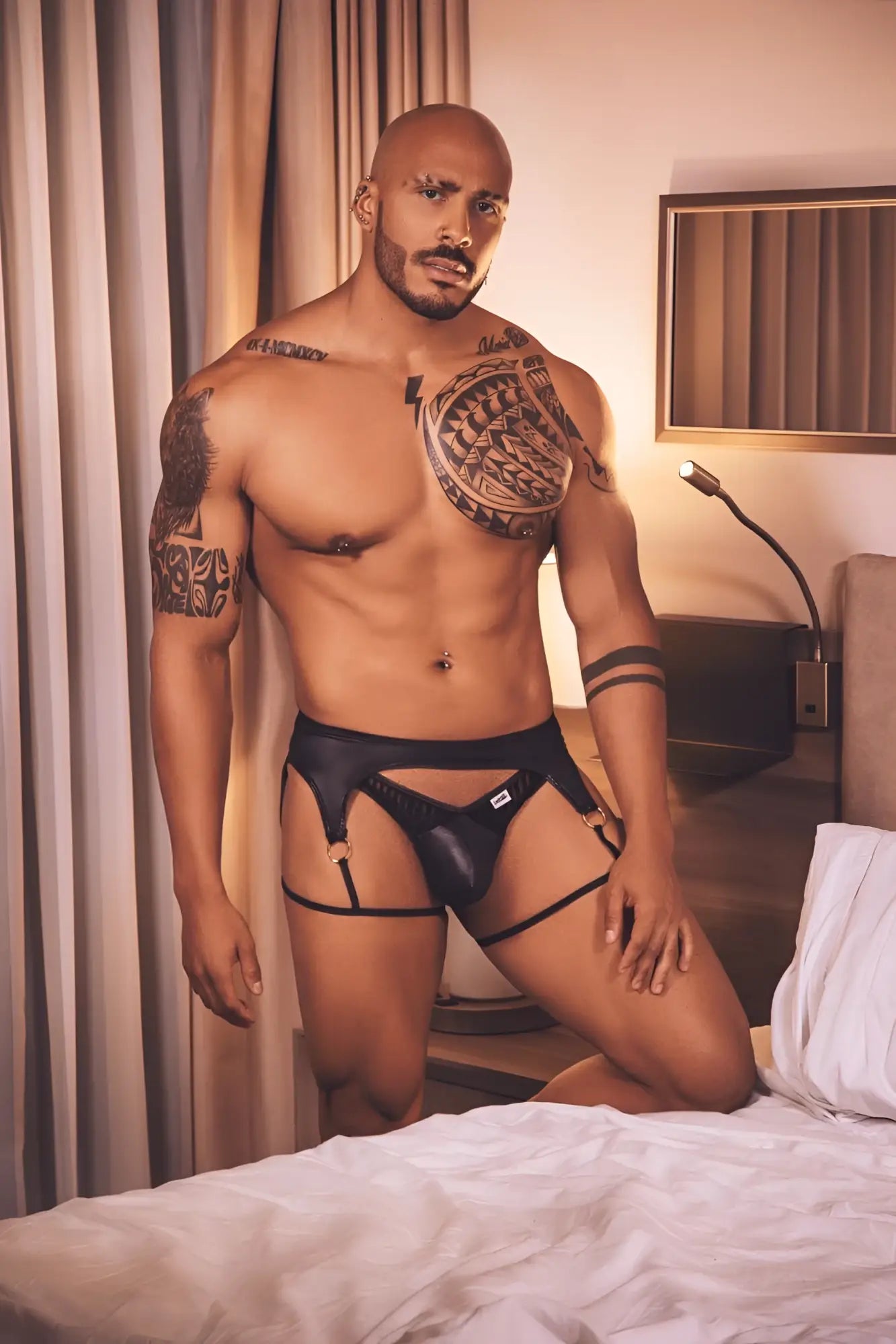 Black leather CandyMan 99655 garter thong with adjustable straps and small white logo on the front