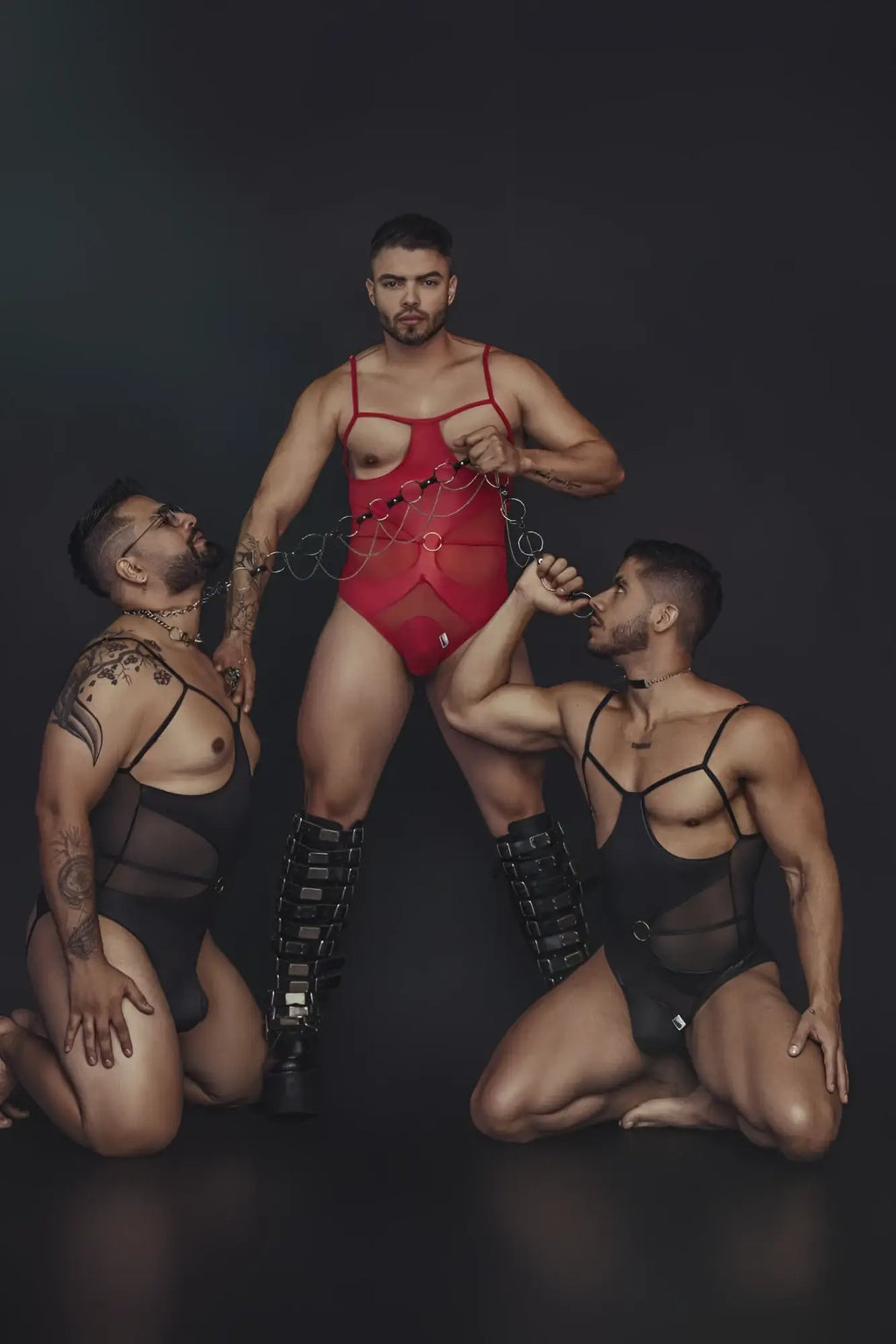 Red CandyMan 99670 harness bodysuit with thin straps and chest cutout in a sleek red fabric