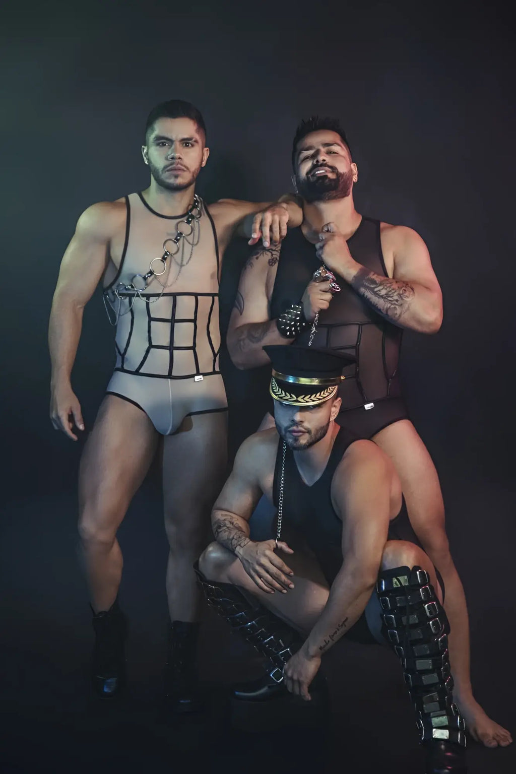 Black leather harness with silver chains and gold-trimmed cap on candyMan 99683X tulle bodysuit in black