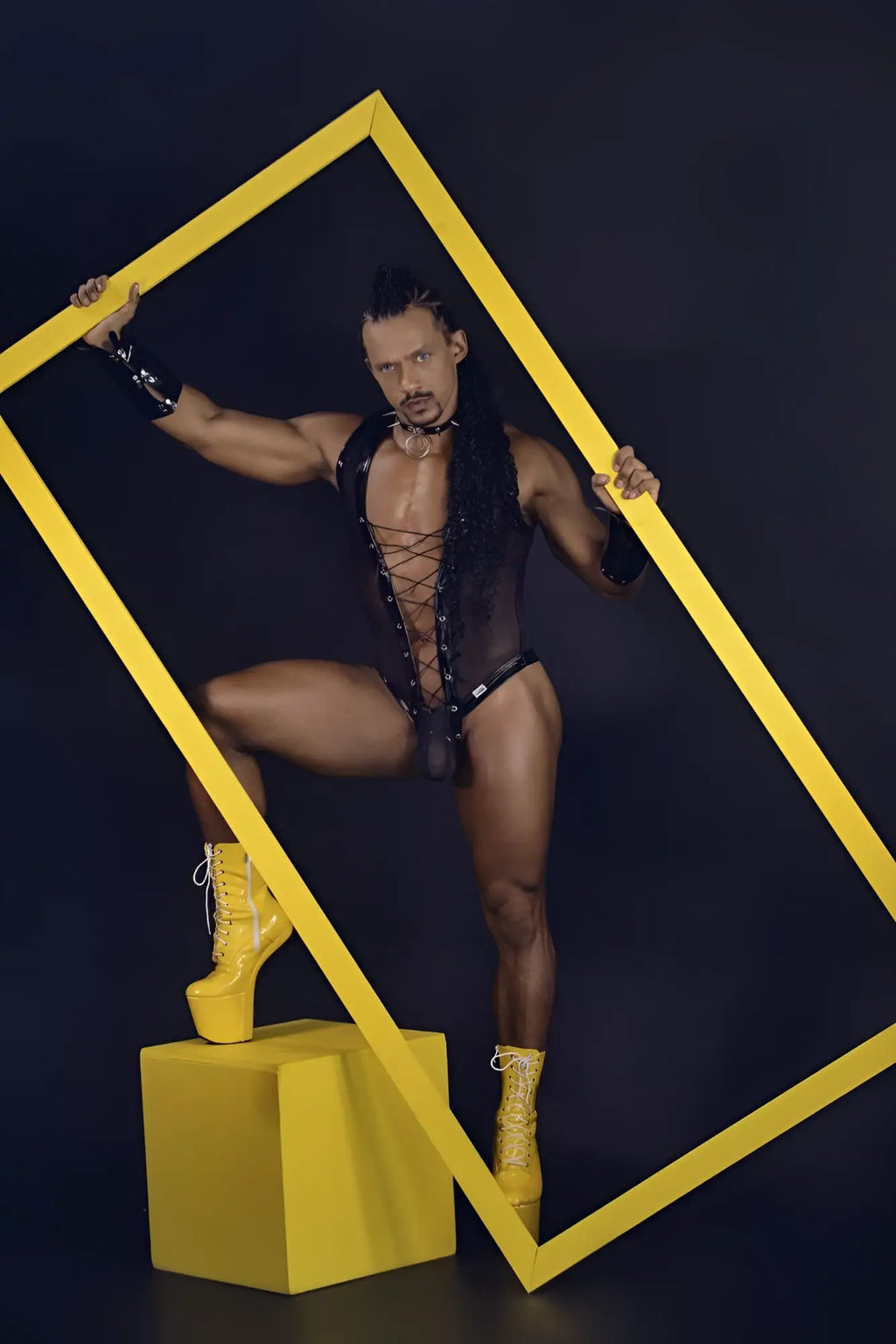 CandyMan 99774 gladiator bodysuit in black features a lace-up corset style with sheer mesh overlay