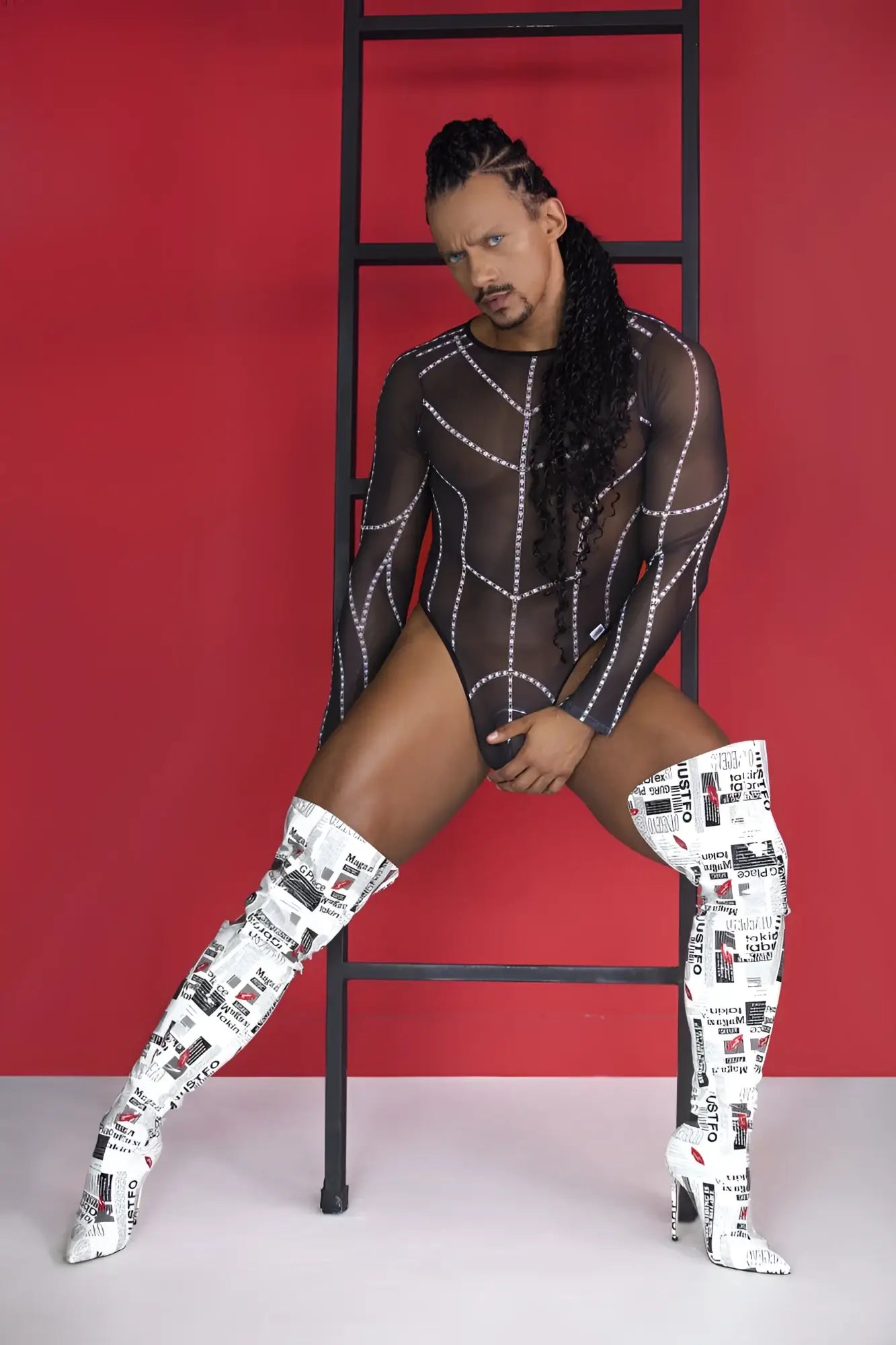White over-the-knee boots with black text and graphic collage print paired with candyman 99816 mesh bodysuit black