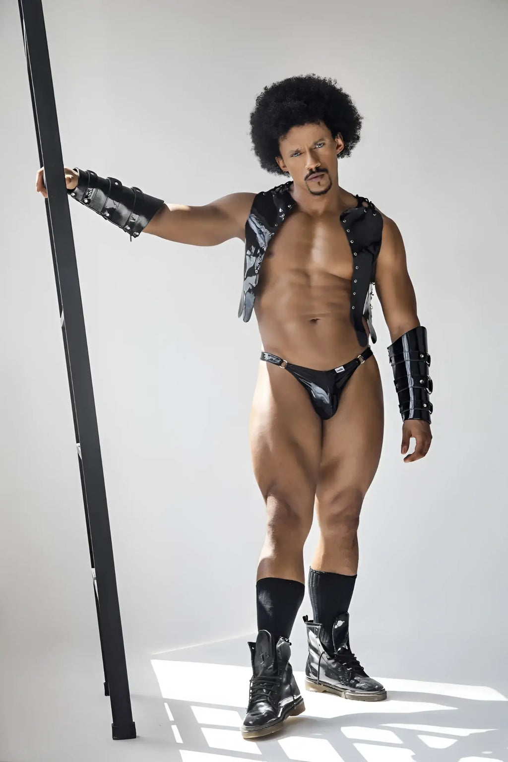 Black leather vest with silver studs and matching black armored arm guards from Candyman 99819 Dom Thongs gloss black