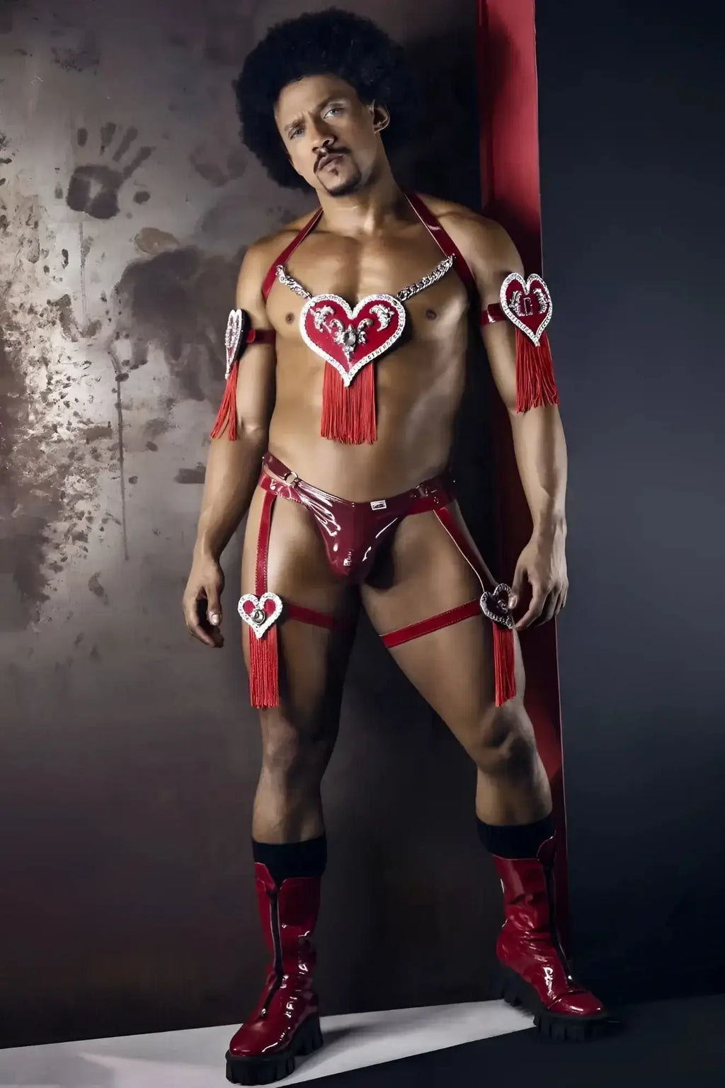 CandyMan 99819 dom thongs in gloss wine red latex with heart-shaped embellishments and tassels visible from the back