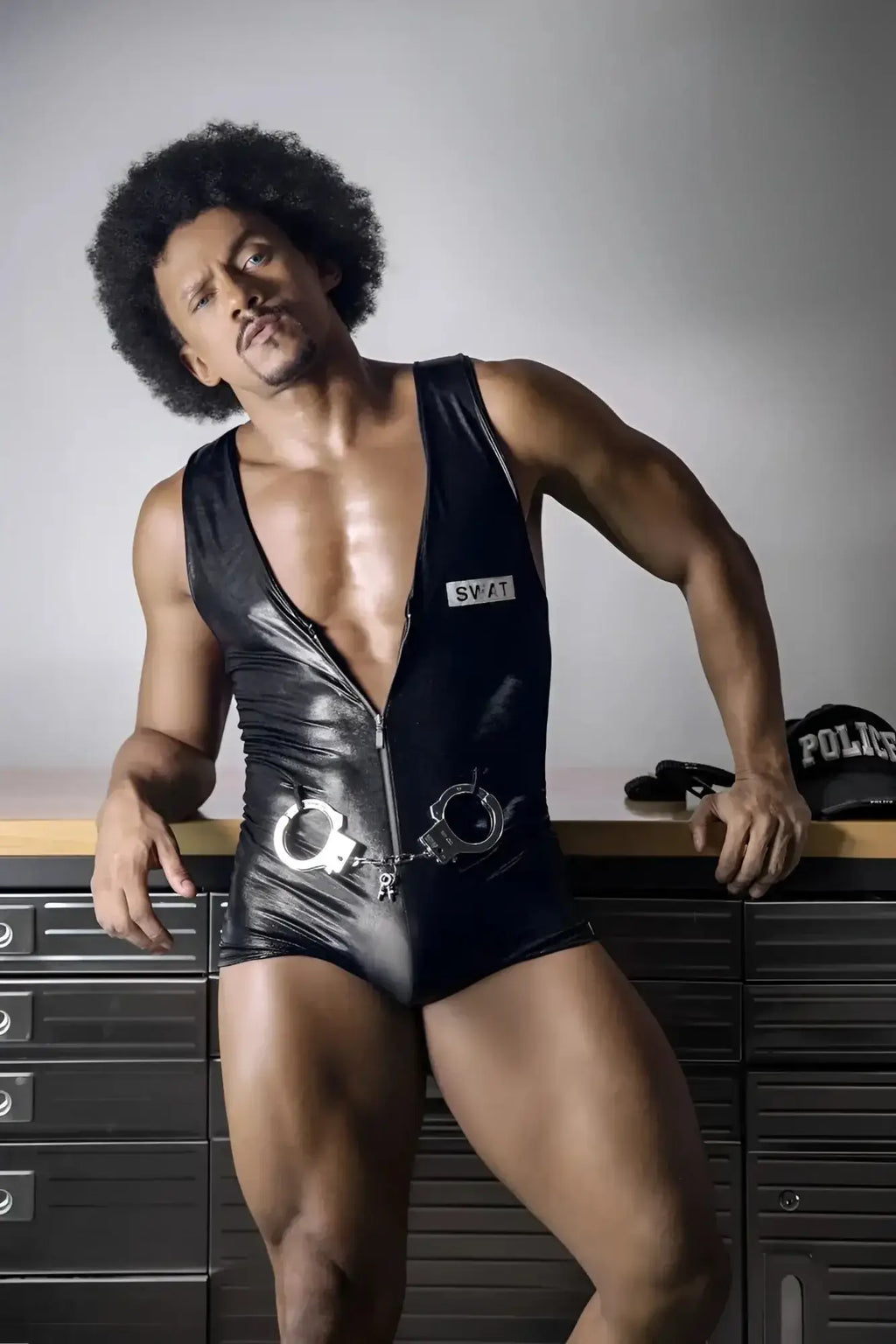Black shiny vinyl CandyMan 99844 police bodysuit with silver handcuffs attached at the waist