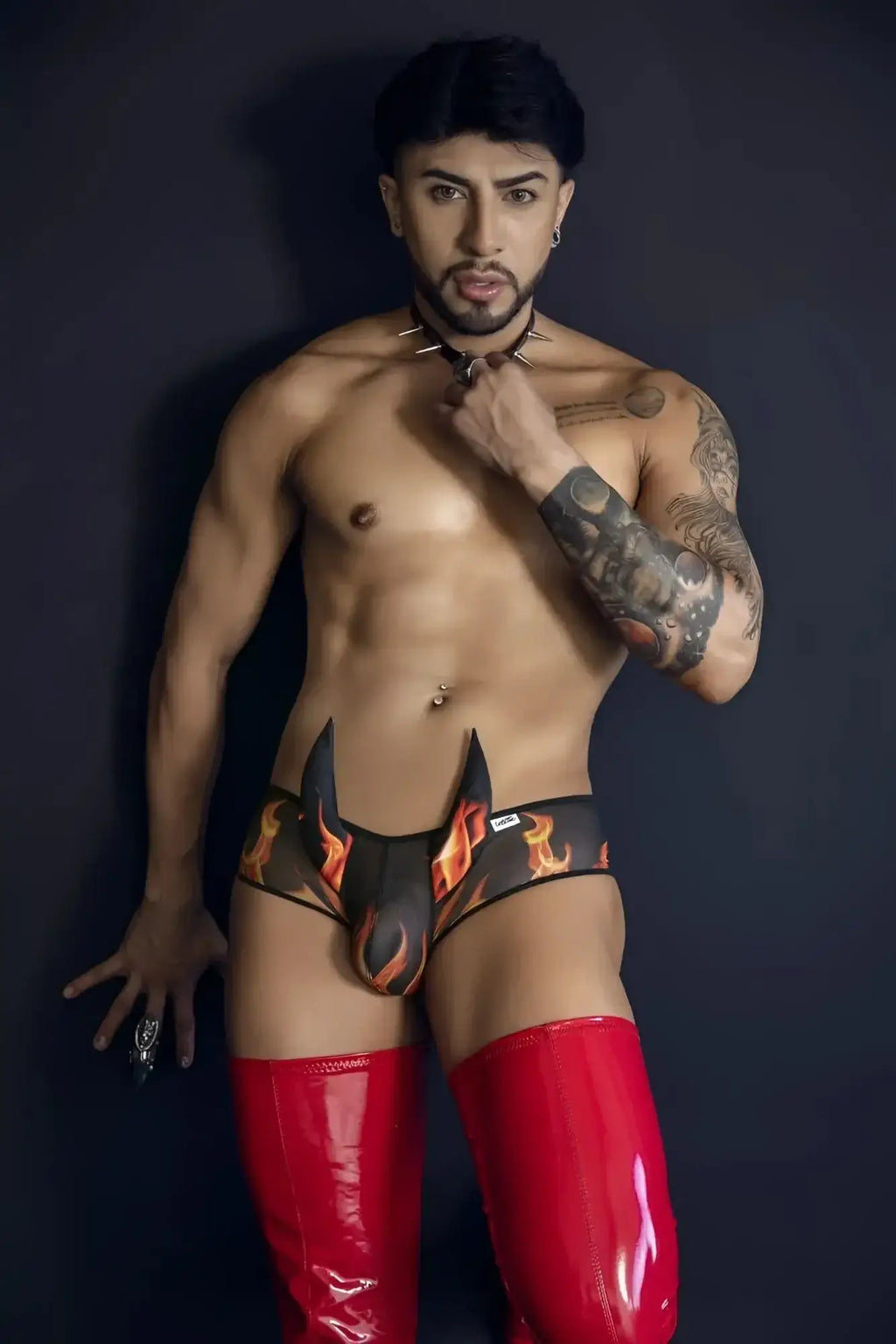 CandyMan 99917 wicked trunks black black and orange flame-patterned briefs with glossy red latex thigh-high boot