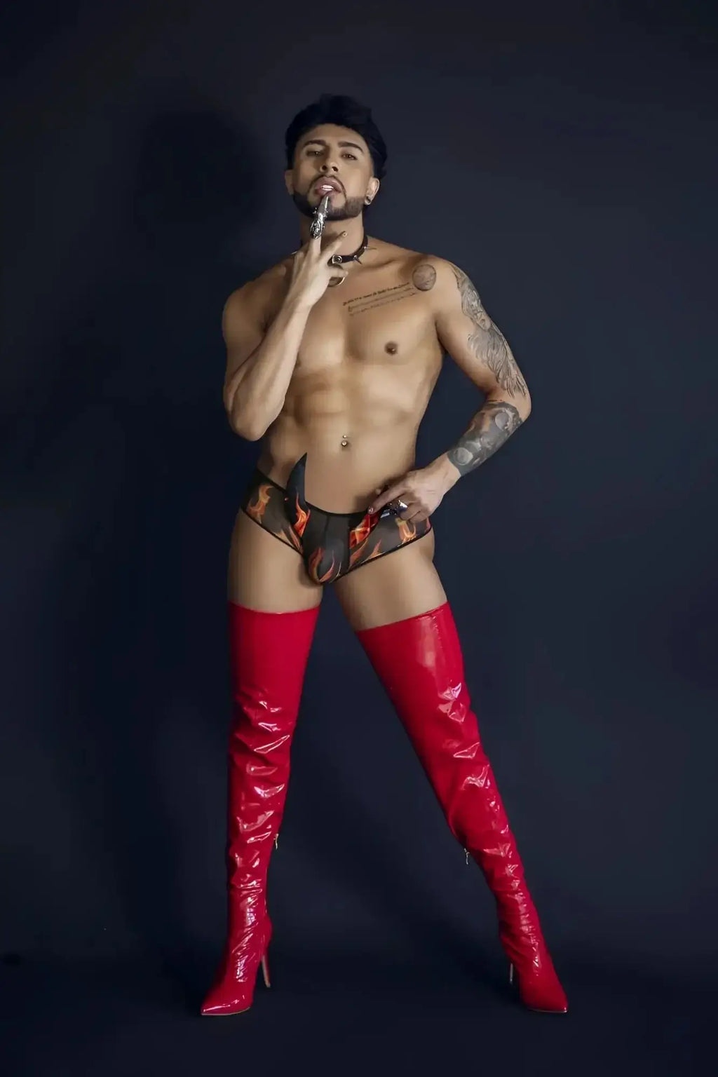 Shiny red thigh-high boots from candyman 99917 wicked trunks in black with a glossy finish