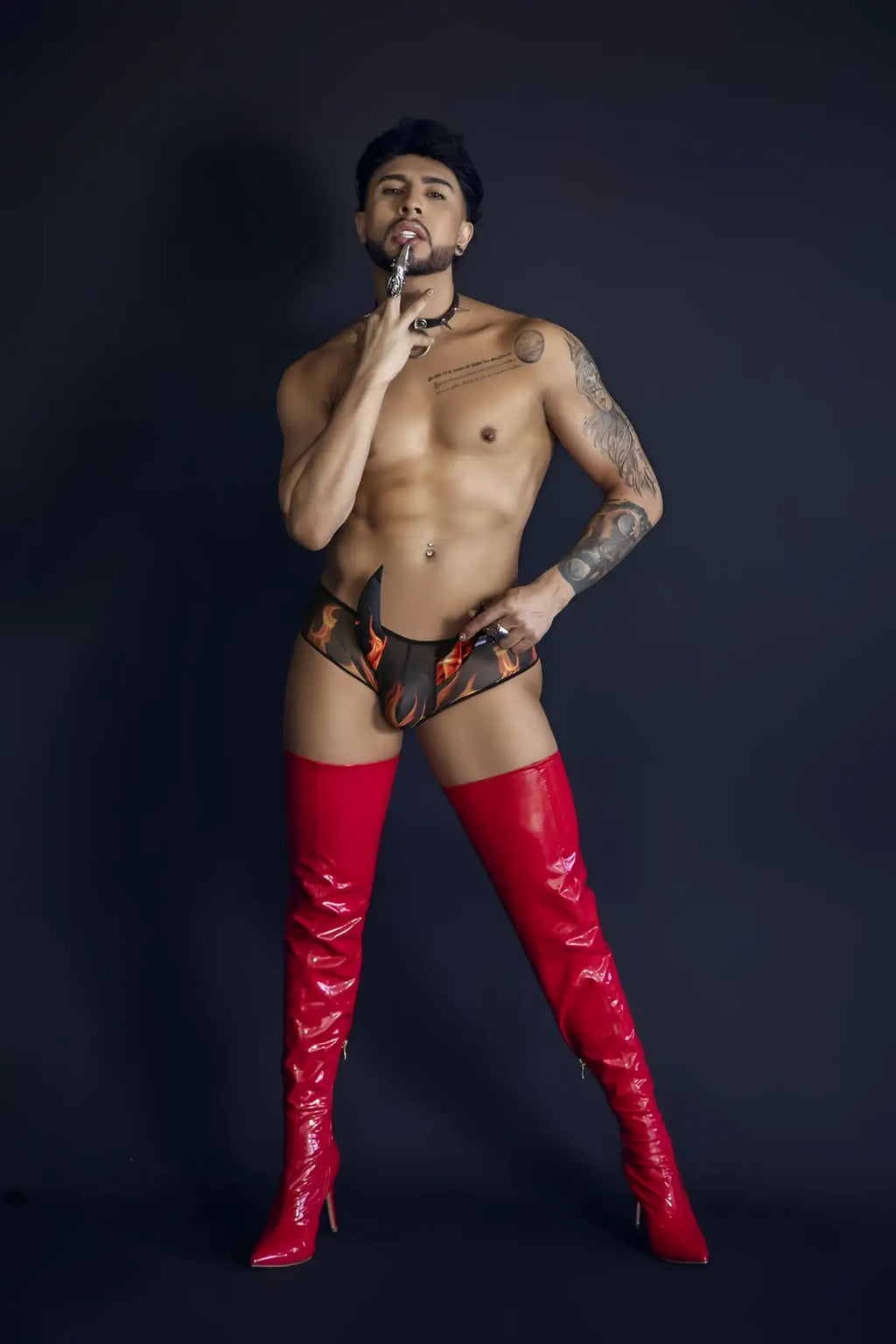 Shiny red thigh-high boots from candyman 99917 wicked trunks in black with a glossy finish