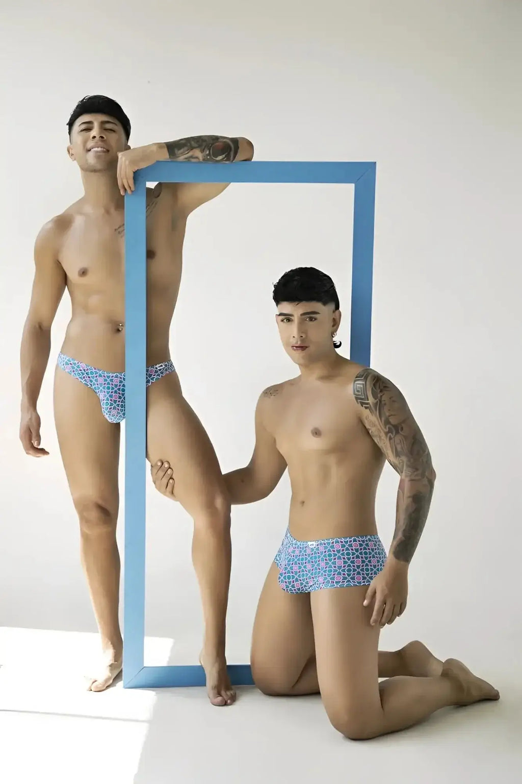 CandyMan 99924 blue printed thongs lifestyle shot featuring two men posing with a blue frame.