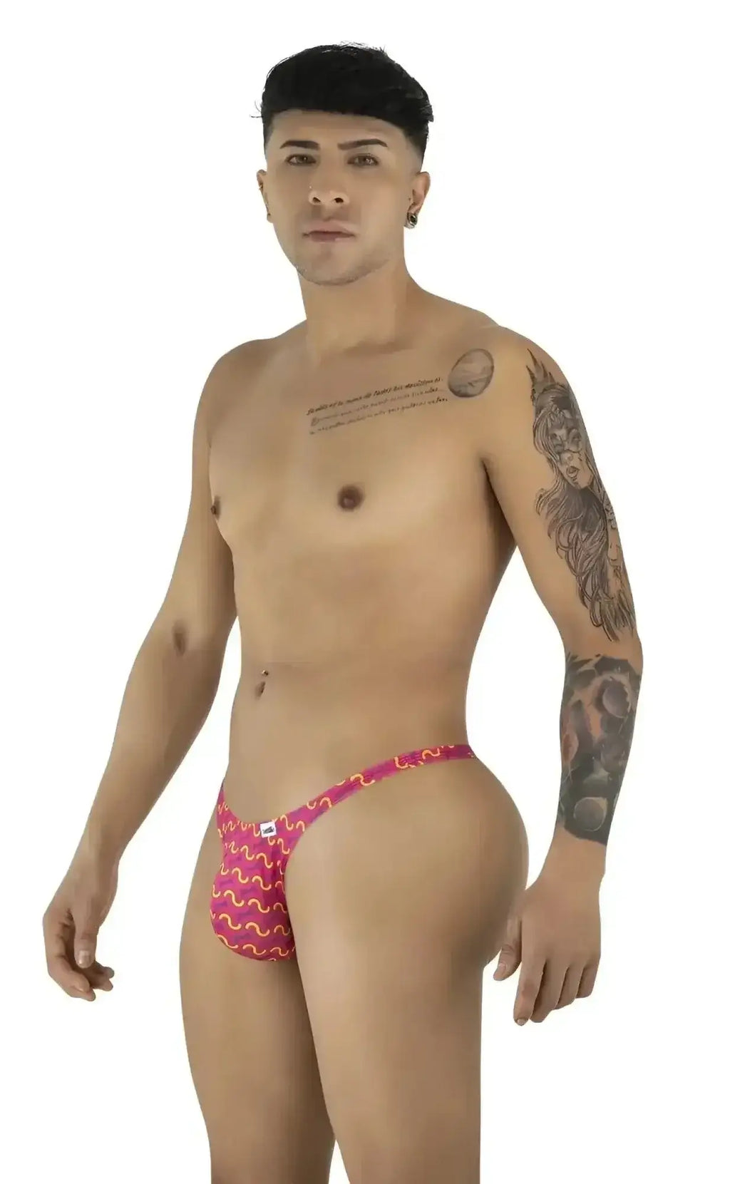CandyMan 99924 thong in printed fuchsia, shown in a front-side studio view on a male model.