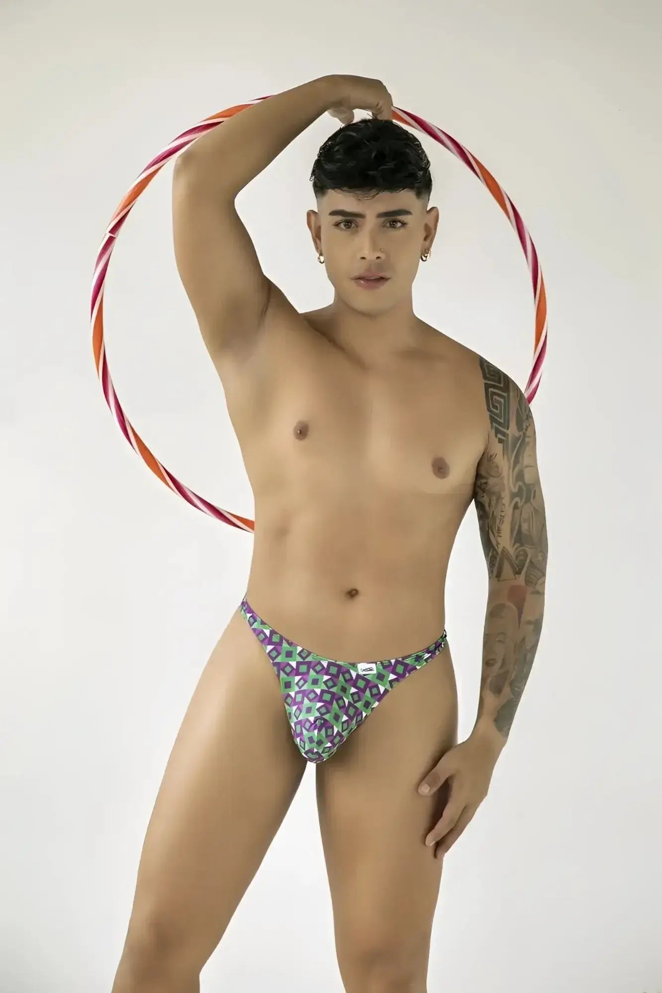 Lifestyle shot: Model wearing CandyMan 99924 printed purple thong.