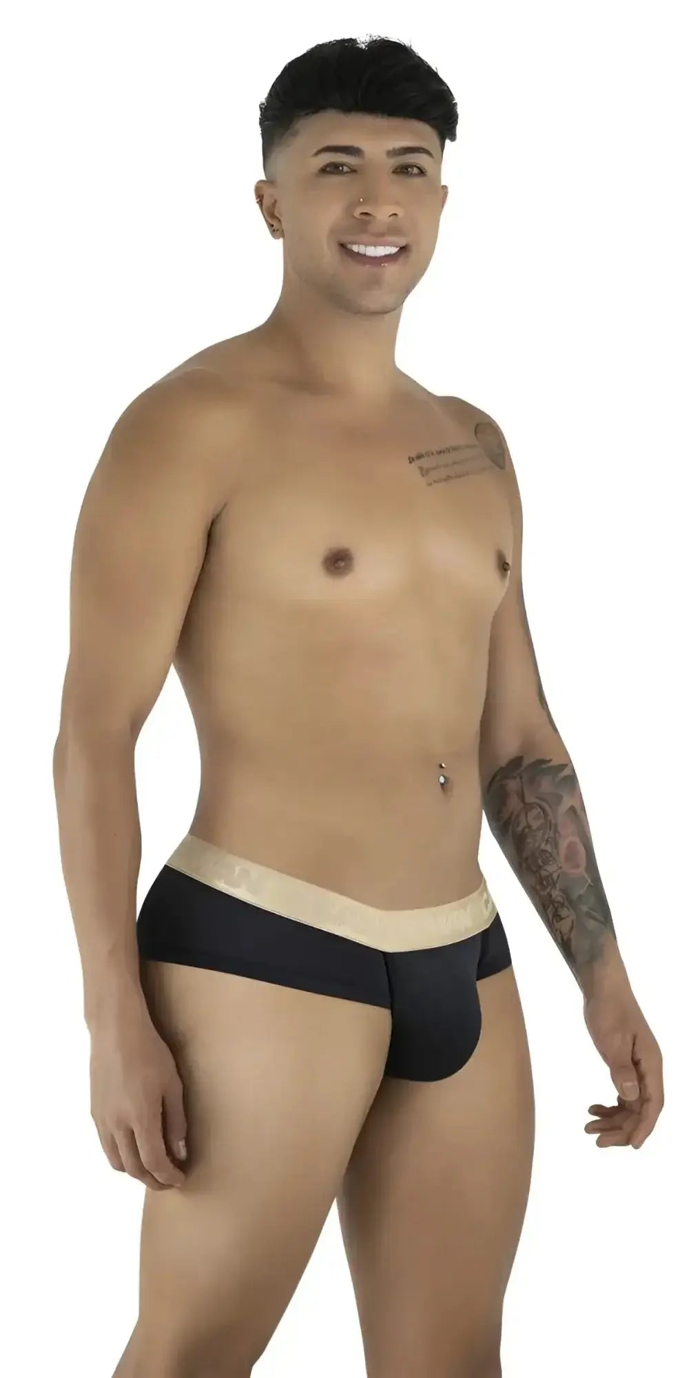 CandyMan 99932 black-gold briefs in a lifestyle shot showing a man wearing the underwear from a three-quarter view.
