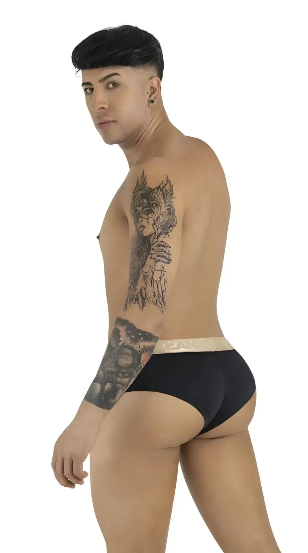 CandyMan 99932 briefs in black-gold, lifestyle shot of a model seen from the side wearing the underwear.