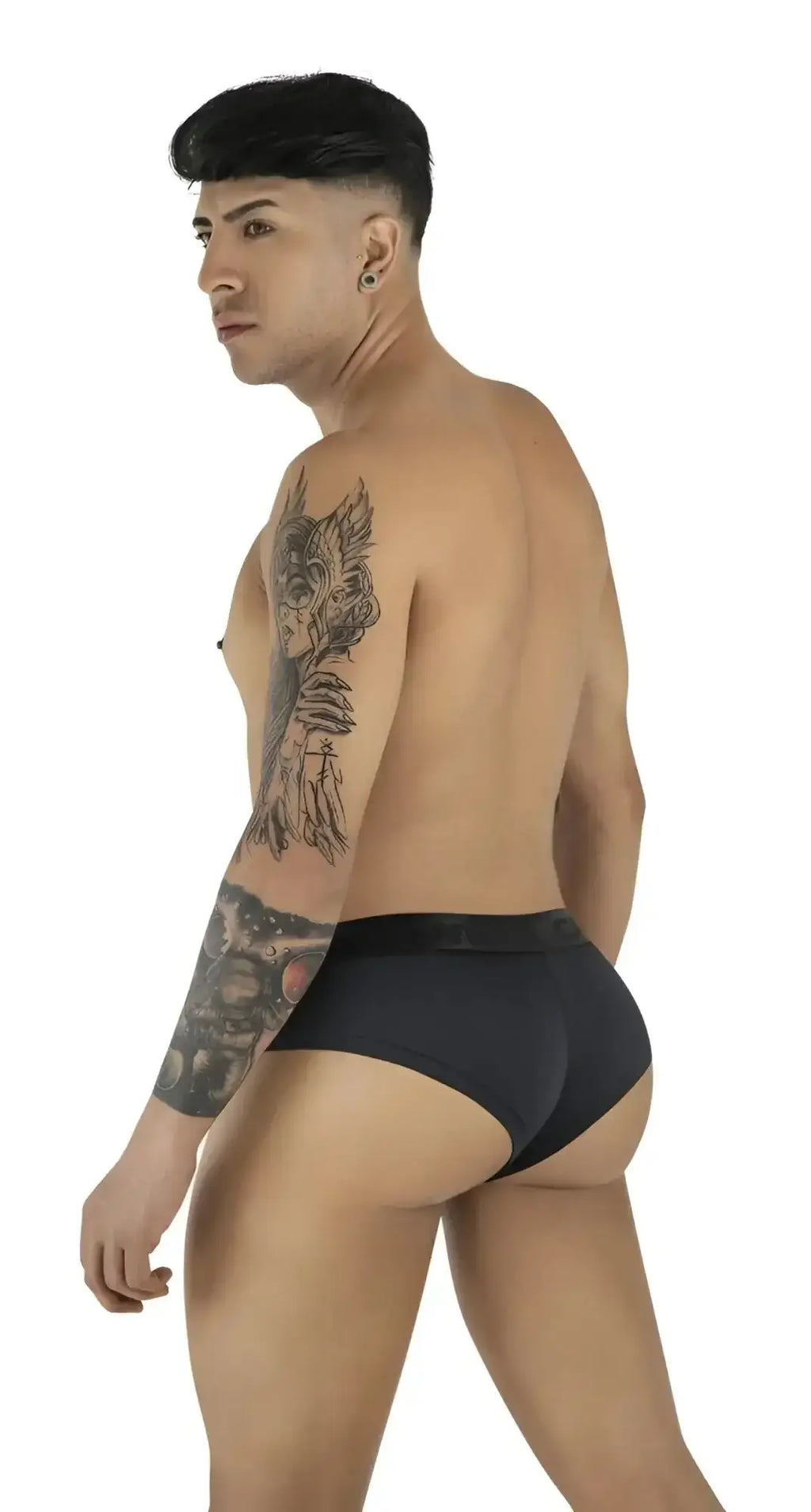 CandyMan 99932 black briefs shown from a rear-angle view on a tattooed model.
