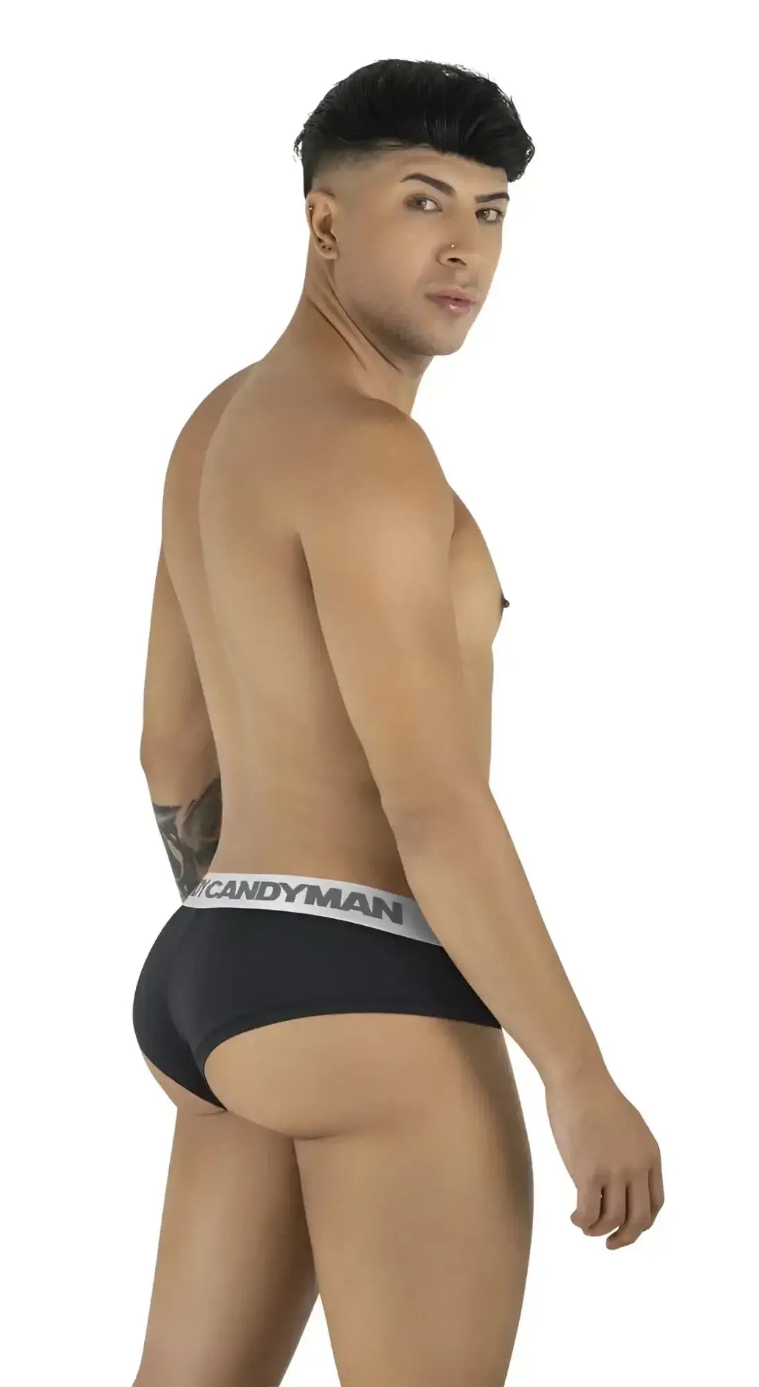 Side view of a model wearing black CandyMan 99932 briefs with a logo waistband.