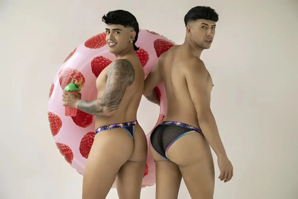 Lifestyle shot of two models wearing CandyMan 99935 black mesh briefs.