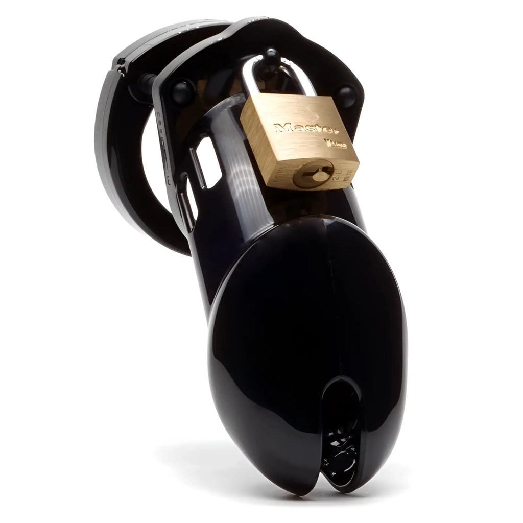 Black glossy plastic cockcage cb-x cb-6000 with gold-colored master lock attached for secure chastity use