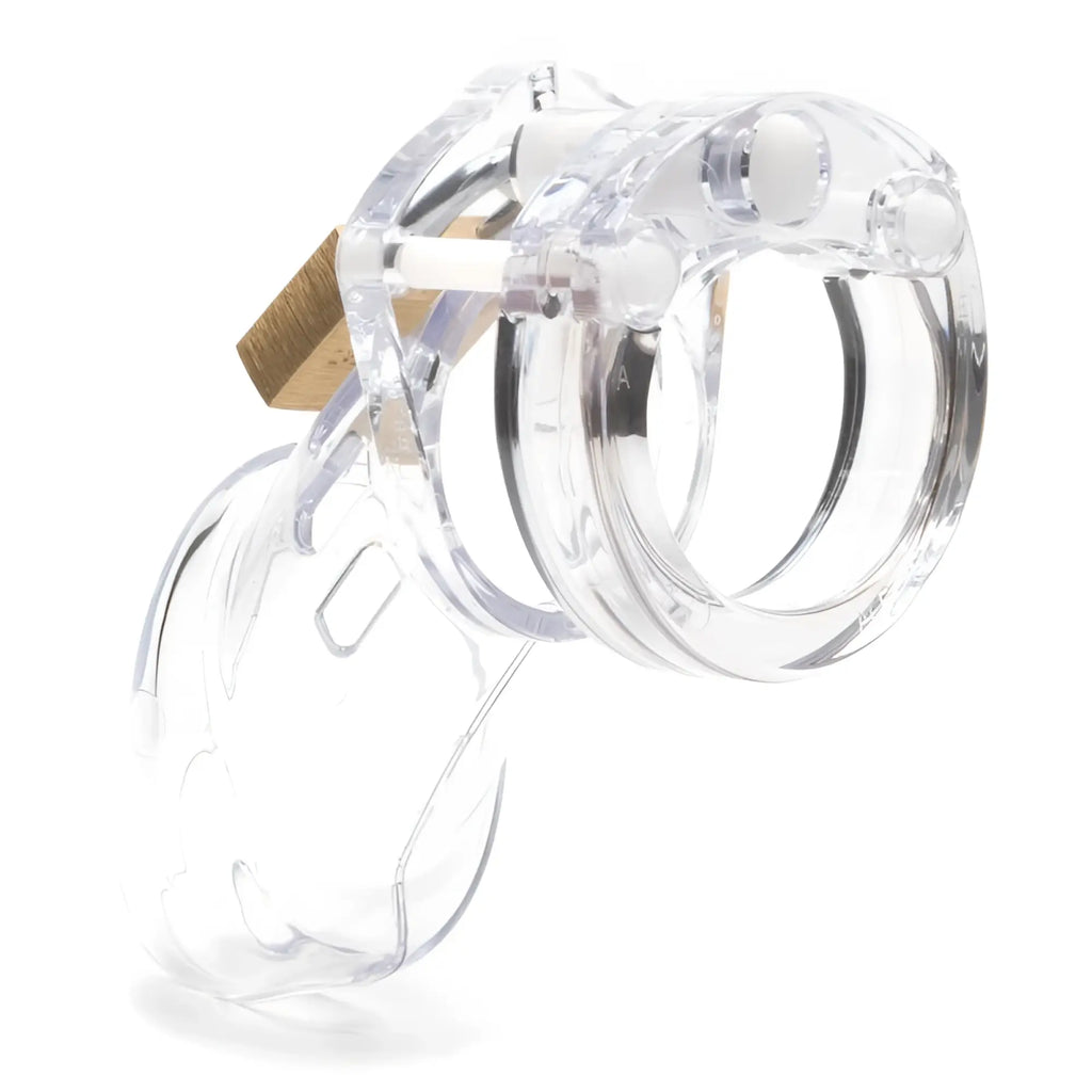 Clear plastic chastity cage cb-x cockcage cb-6000 clear with a gold-colored lock for secure wear