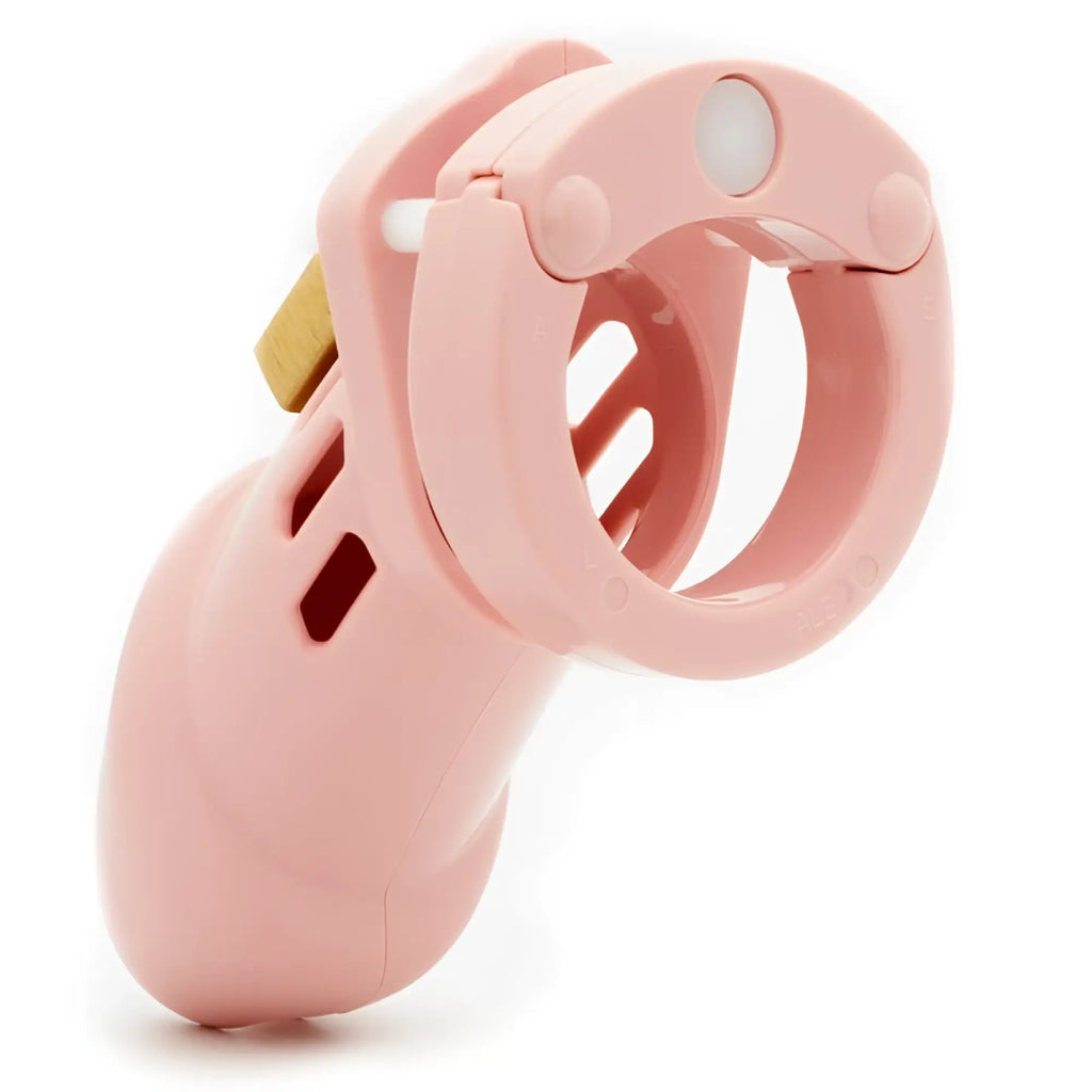 Pink cb-x cockcage cb-6000 chastity cage with gold metal clasp made of plastic for secure wear