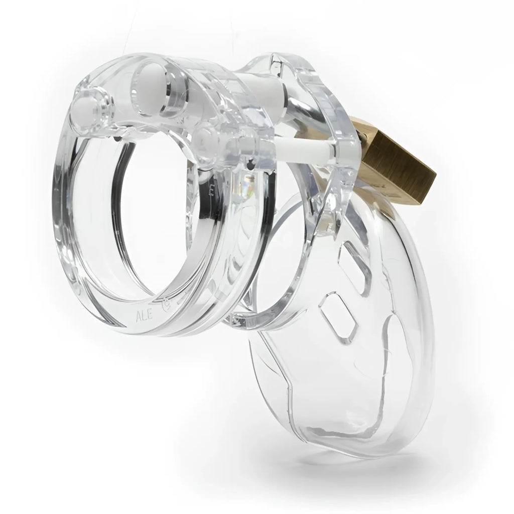 Clear plastic cb-x cockcage cb-6000s with gold-colored lock designed for secure cock restraint use