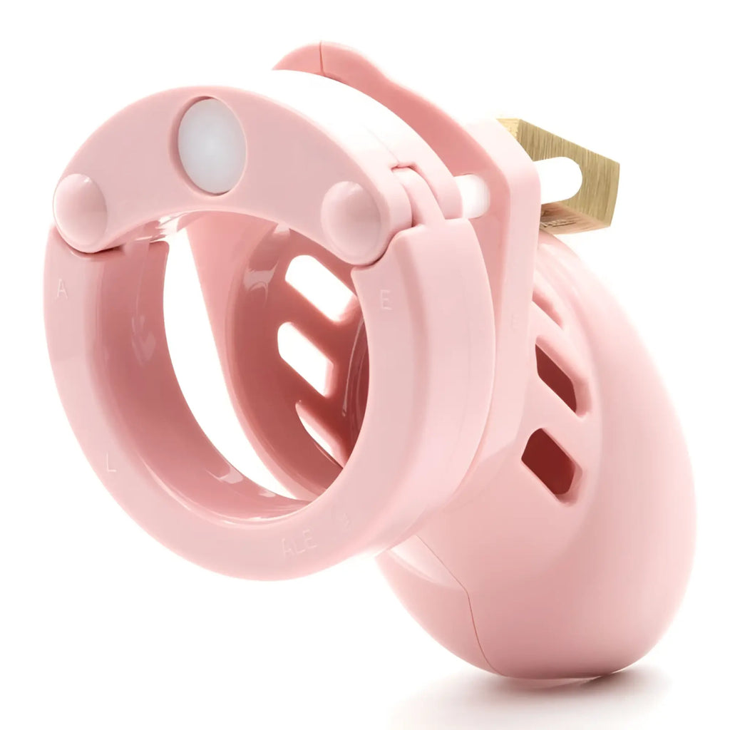 Pink plastic cock cage cb-x cb-6000s with gold-colored lock designed for secure male chastity play
