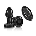 Black glossy plastic anal plug with faceted diamond design and matching remote control from cheeky charms gunmetal series
