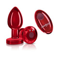 Red metallic rechargeable vibrating metal butt plug with faceted design and oval remote control medium size