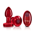 Red metallic rechargeable vibrating metal butt plug with remote control featuring a faceted design and power button