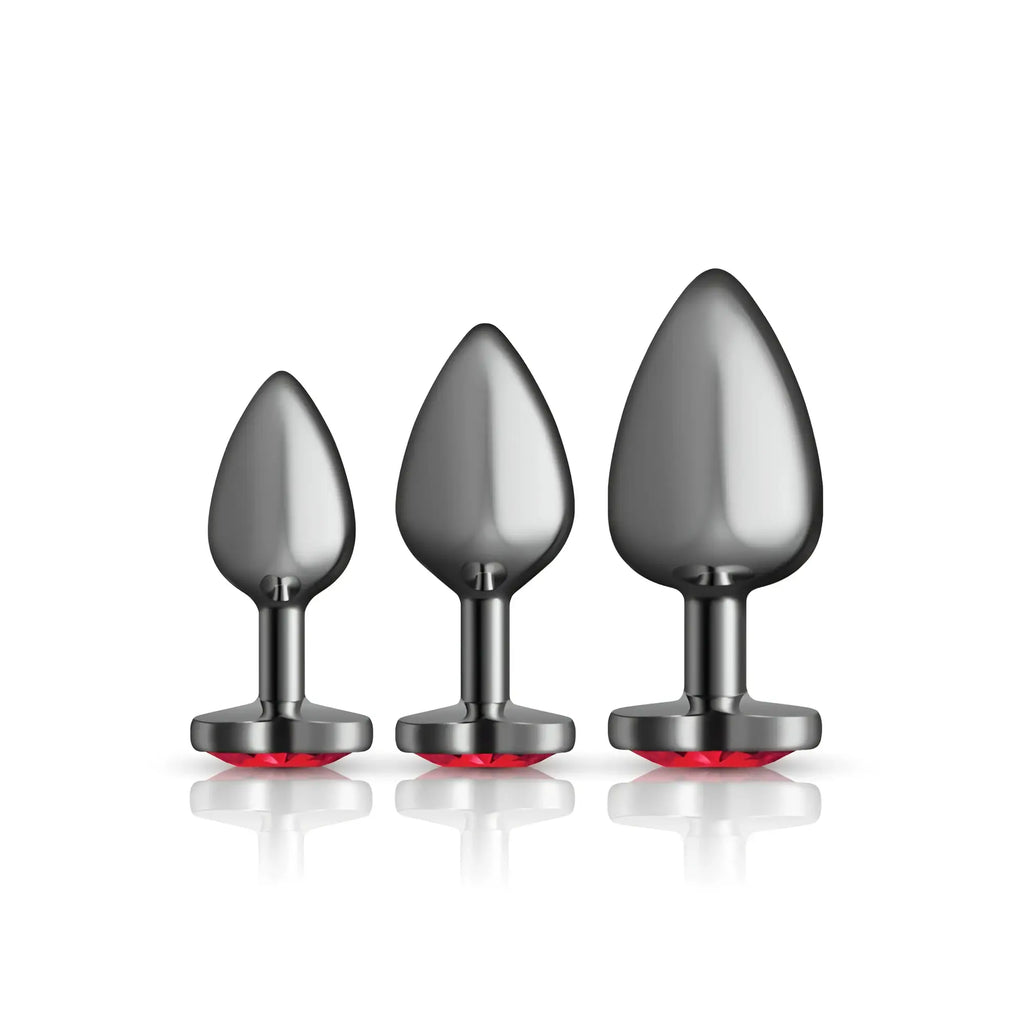 Set of three gunmetal metallic anal plugs with dark red heart-shaped gemstone bases by cheeky charms