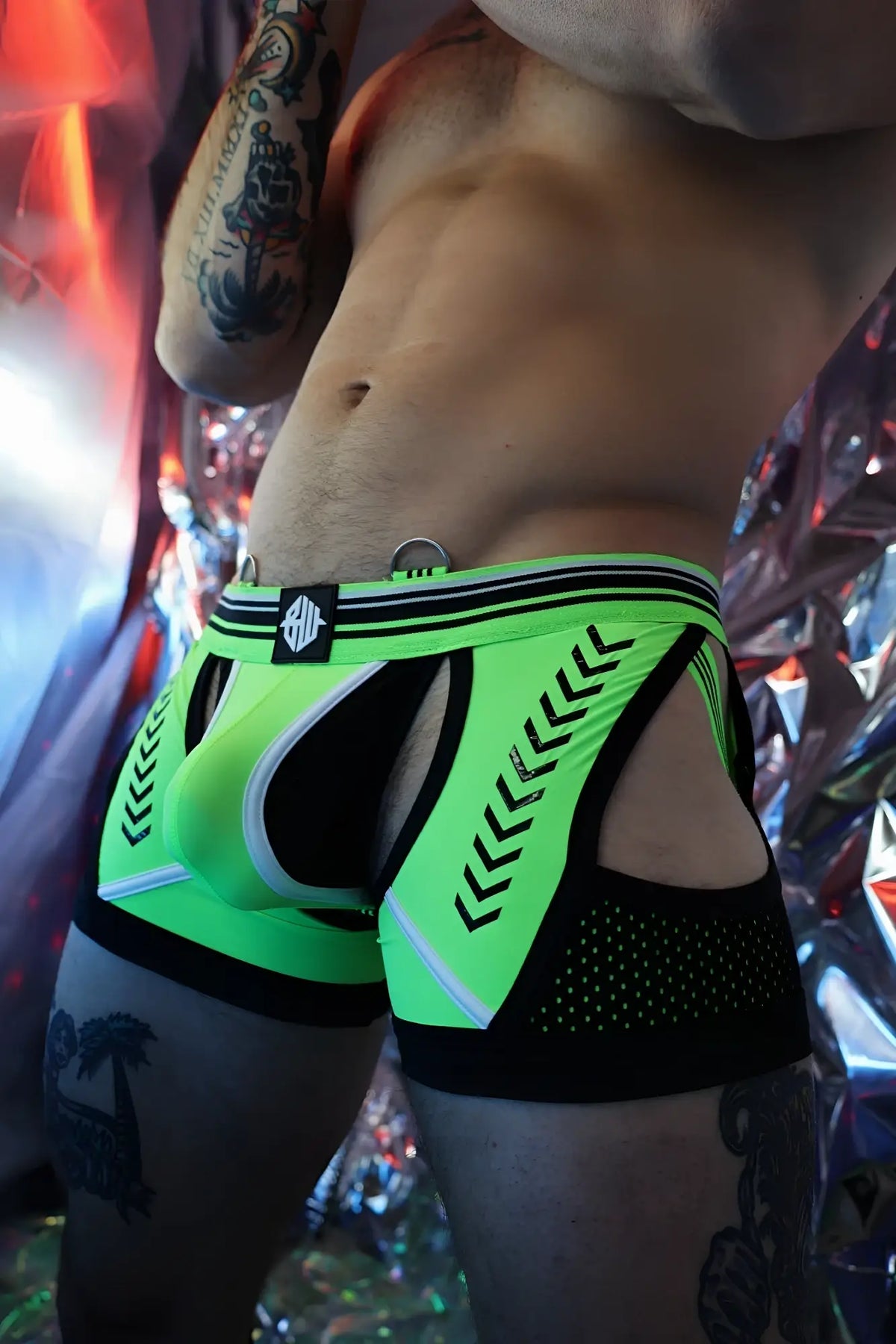 Circuit breaker chock neon green and black athletic briefs with bold geometric pattern mesh panels and branded waistband logo